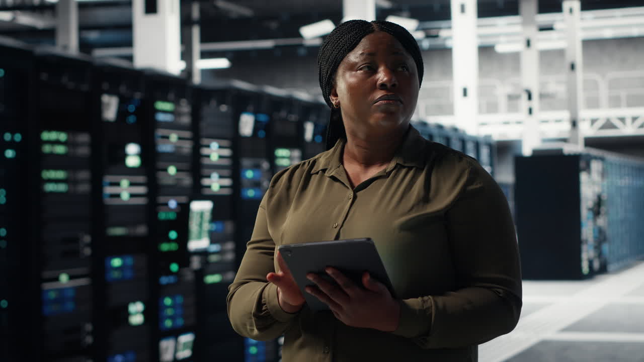 Technician using tablet in data center, integrating new technologies