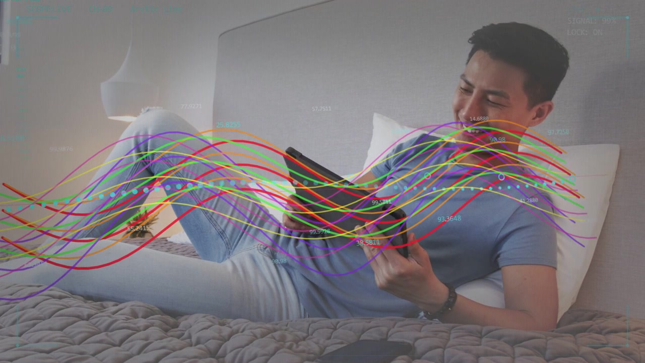 Man on bed tapping tablet starting waveforms sweeping across frame testing PHASE LOCK for tech
