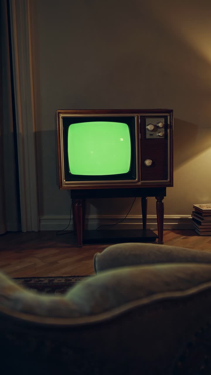 Vintage living room with retro TV displaying a green screen video