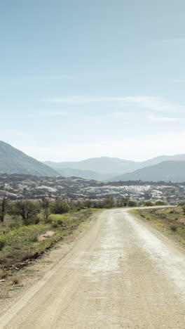 driving-in-atlas-mountains,-morocco-in-vertical