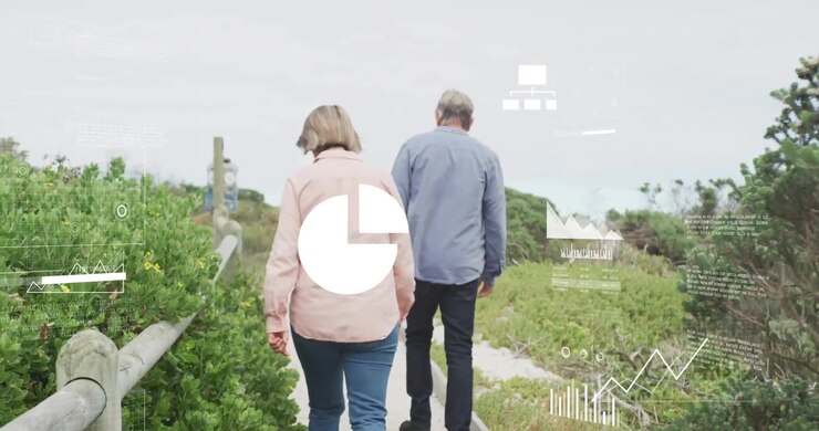 Mature couple walking boardwalk with dogs initiating cloud icon and charts showcasing analytics