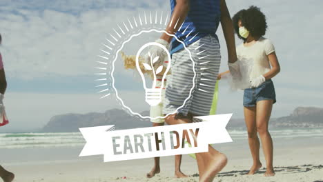 earth day text and light bulb animation over people cleaning beach