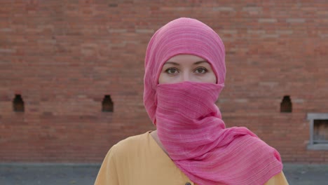 woman wearing a pink hijab