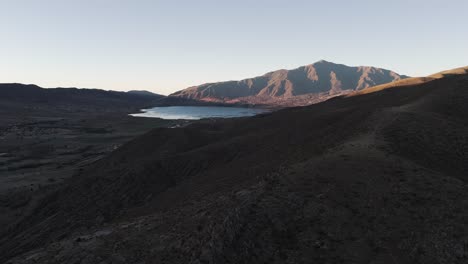 Low-Angle-Drone-Shot-Of-Dique-La-Angostura-Reservoir,-Tucumán,-Tafí-Del-Valle,-Argentina