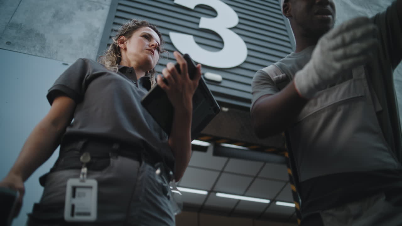 Logistics workers scanning packages at a warehouse