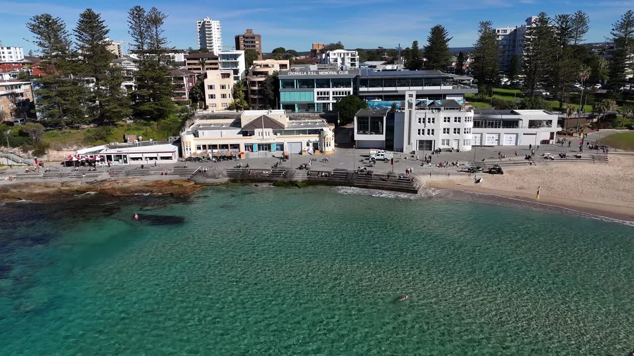 Cronulla waterfront neighborhood with calm turquoise sea and low-rise buildings, Sydney NSW Australia