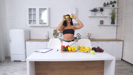 healthy woman in the kitchen with fruits and vegetables