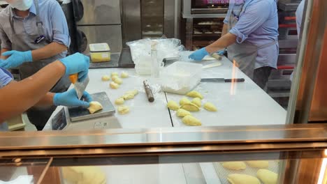 bakery employees making pastries