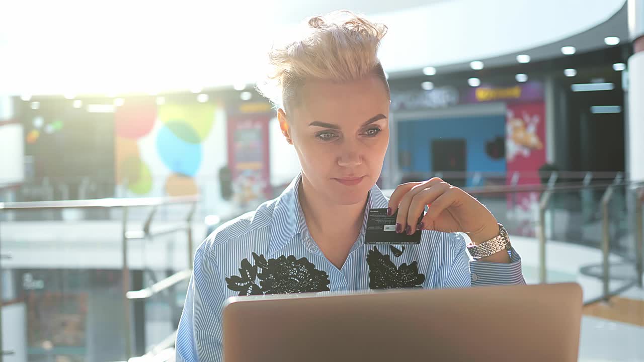Close up hands holding credit card and using laptop indoor, Online shopping, woman happy.
