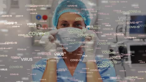 Animation-of-a-surgeon-putting-on-a-mask-in-a-room-over-information-COVID-19-written-in-white-letter