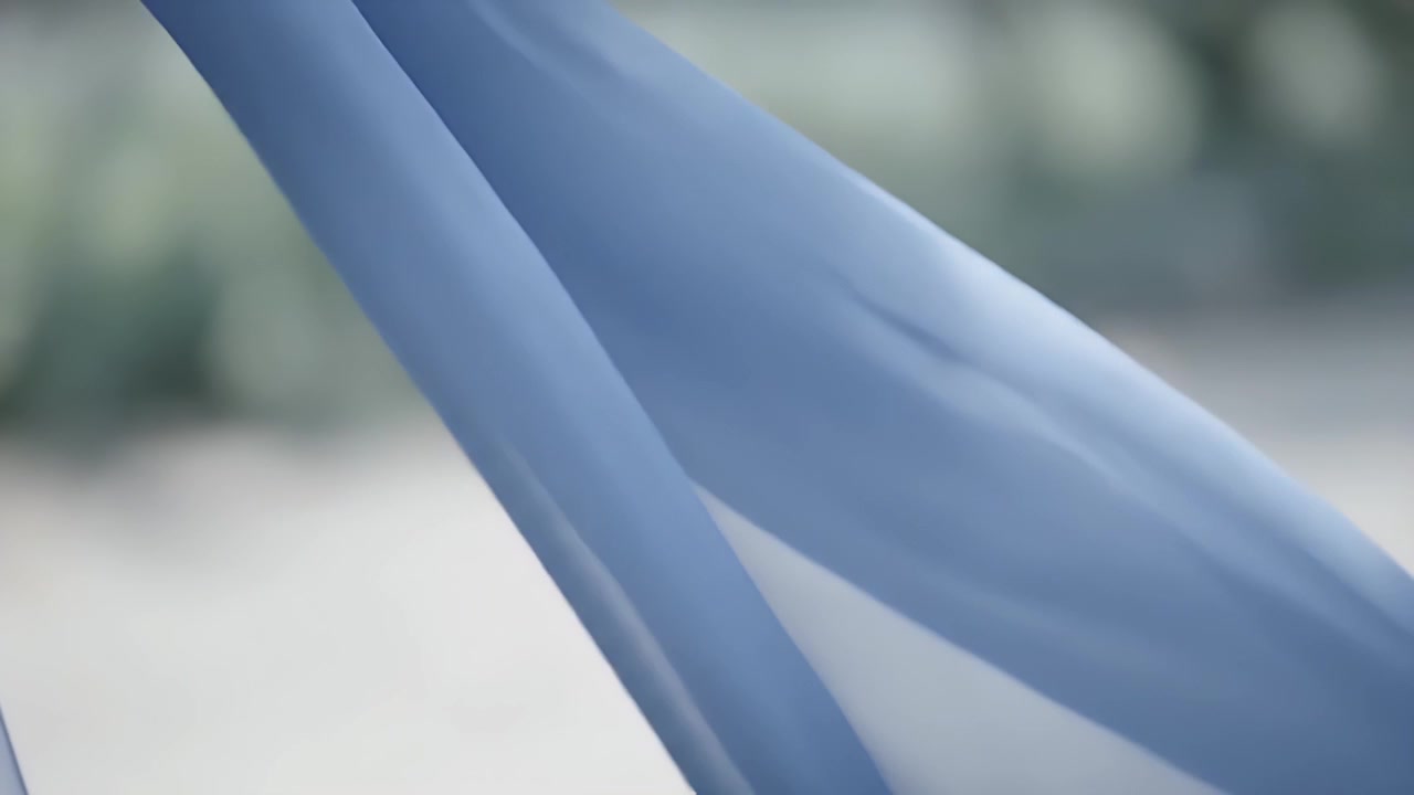 Light Blue Fabric Waving Gently in the Wind