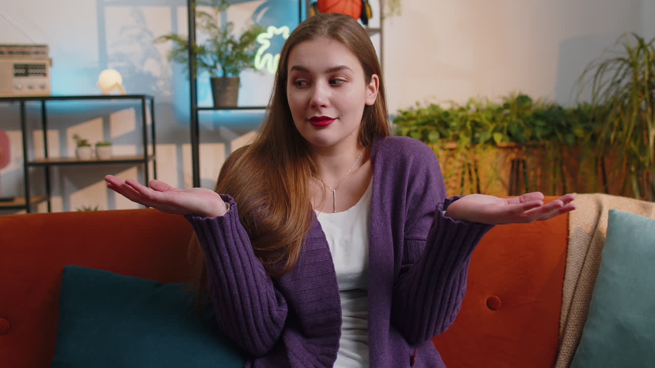 Confused young woman feeling embarrassed about ambiguous question having doubts no idea no answer