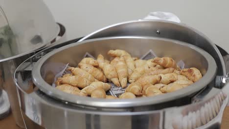crousant tray served for buffet at corporate event, close shot panning, hd video.