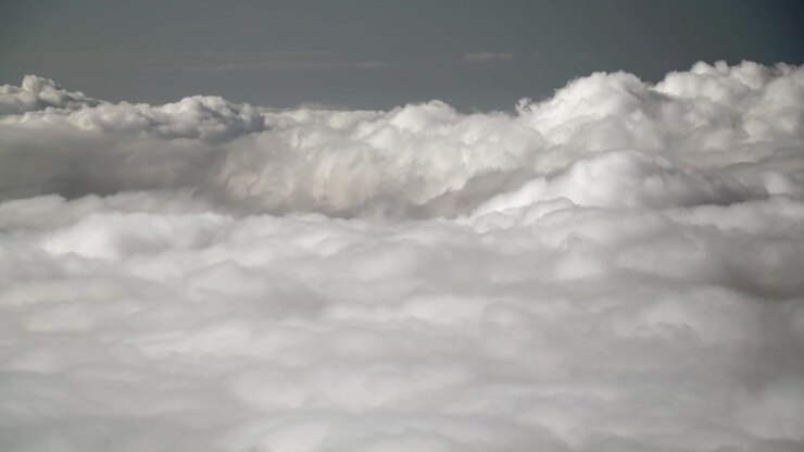 Aerial View of Dense White Clouds Moving Slowly