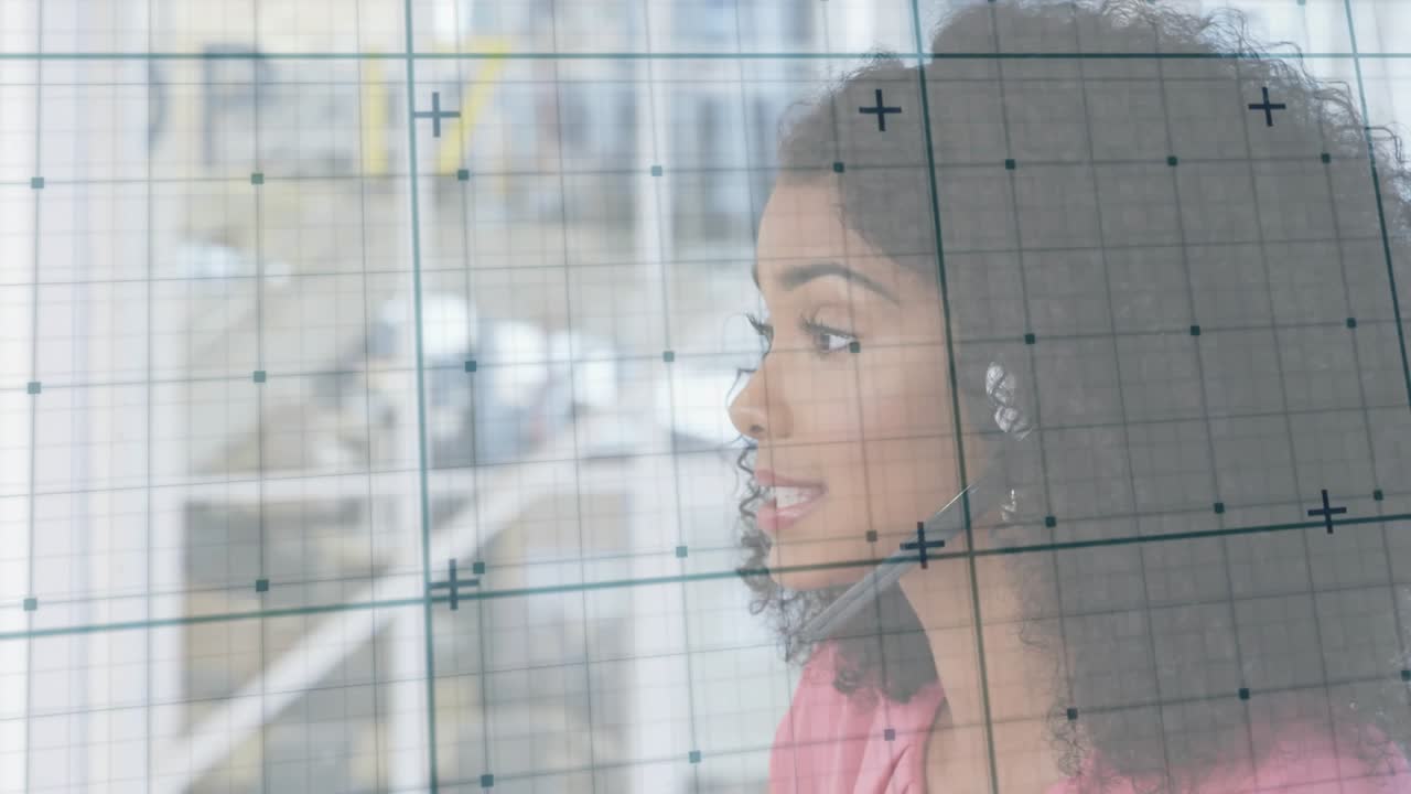Call center agent receiving call, listening then speaking while adjusting headset behind glass grid