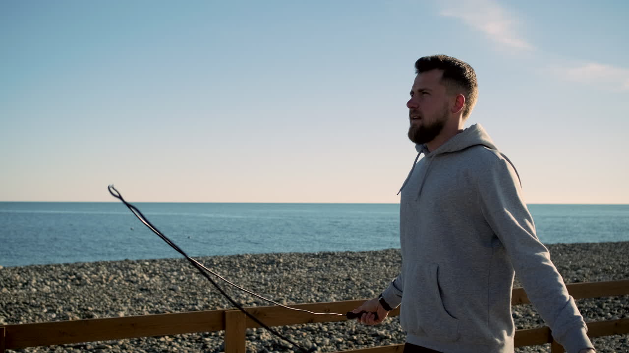 Man Jumping Rope on the Beach