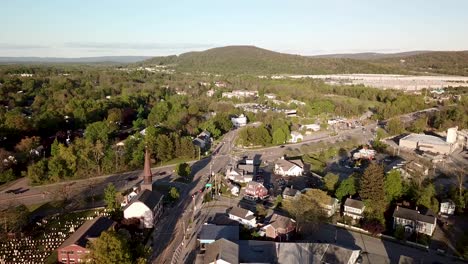 downtown fishkill and the hudson highlands mountains in new york's hudson valley is shown in this 1080 aerial footage