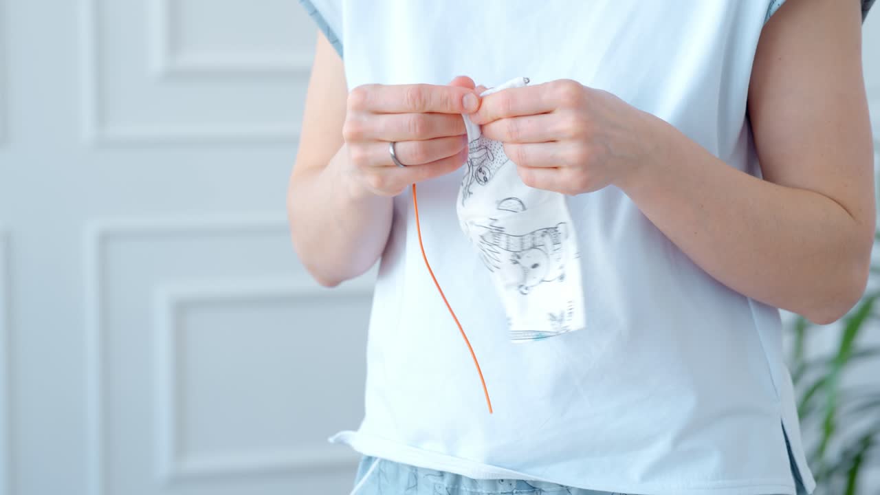 Woman Sewing a Piece of Fabric