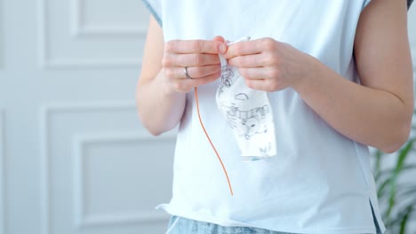 woman sewing a piece of fabric