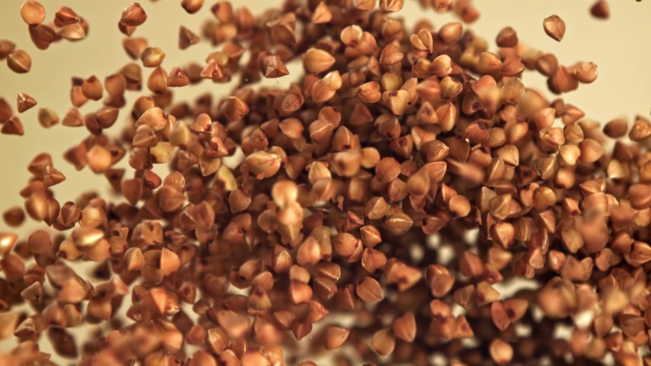 Buckwheat Grains Falling in Slow Motion