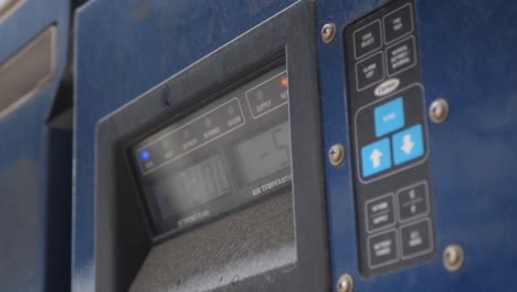 orbital hand held footage of the led display of the machine at the port of karachi in pakistan displaying tempreture and other readings