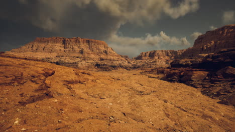 expansive desert landscape showcasing dramatic rock formations at dusk