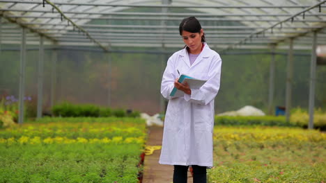 woman standing holding clipboard