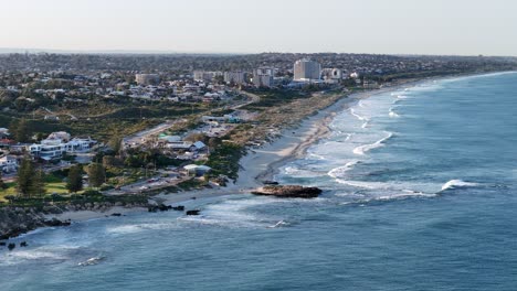 Slow-motion-drone-shot-above-Scarbrough-beach-in-Perth,-Western-Australia