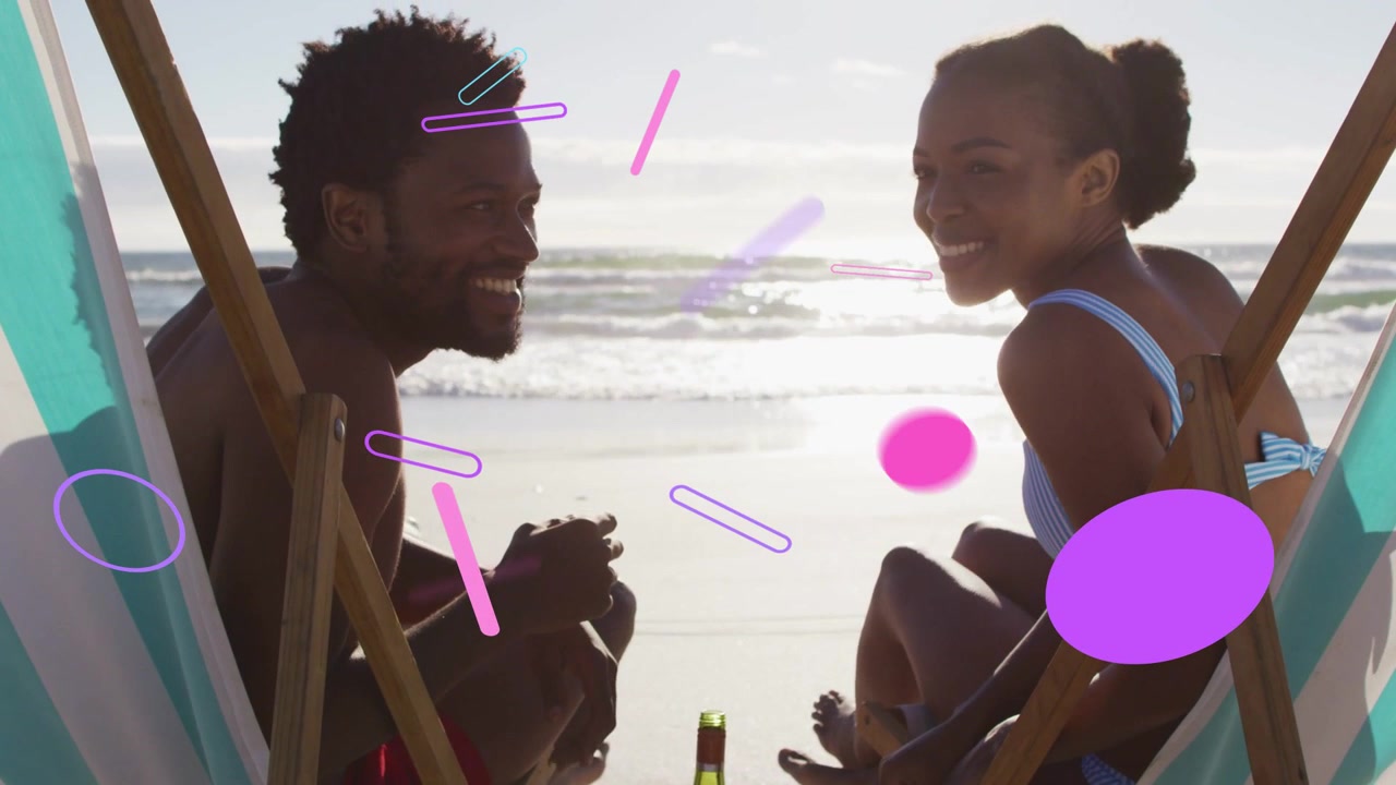 Man and woman smiling, gesturing while pink shapes appearing from top on beach chairs for travel
