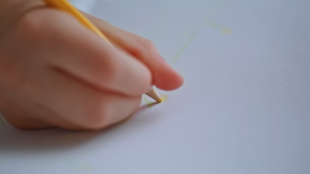 Little girl drawing album home closeup. Unrecognizable focused kid resting house