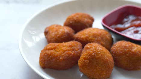 crispy fried chicken nuggets with ketchup