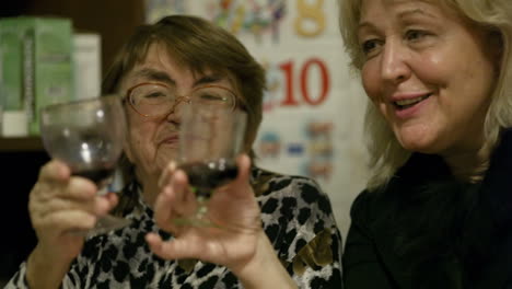 two women enjoying a drink together