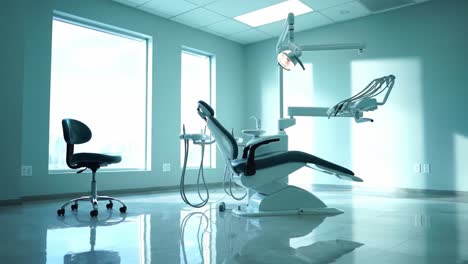 contemporary dental clinic interior with modern equipment and spacious windows, featuring a well-designed dental chair and professional tools for oral care
