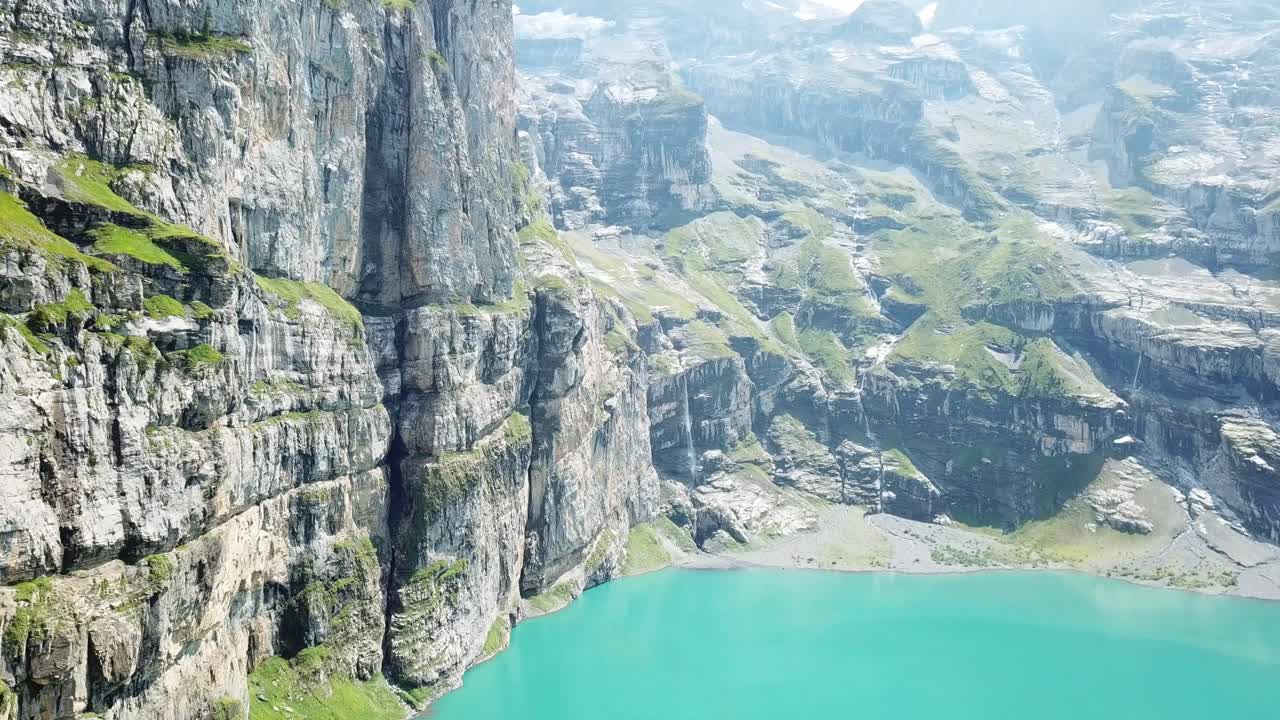 Drone footage at the green beautiful Oeschinen lake in the Bernese Oberland, Switzerland. (Oeschinensee)