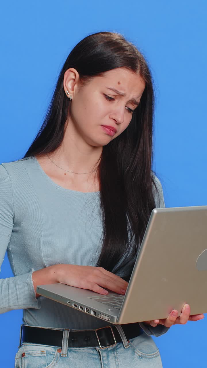 Displeased caucasian woman use laptop loses becoming surprised by game fail computer virus loss