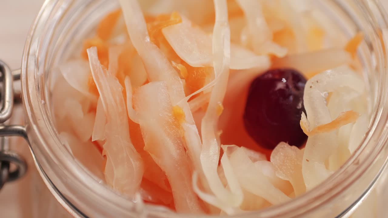 Sauerkraut fermented cabbage variety preserving jars. Homemade Sauerkraut with Carrot and Salad Cabbage with Beetroot on a wooden table. Fermented food.