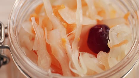 sauerkraut fermented cabbage variety preserving jars. homemade sauerkraut with carrot and salad cabbage with beetroot on a wooden table. fermented food.
