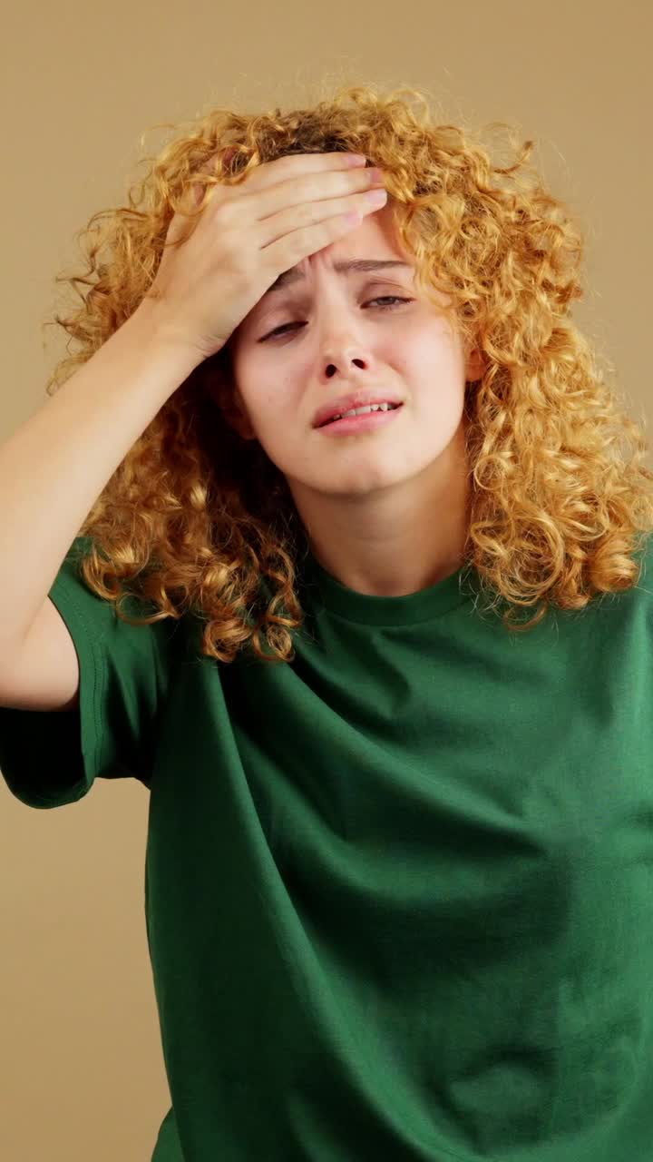 Young woman suffering from pain or headache