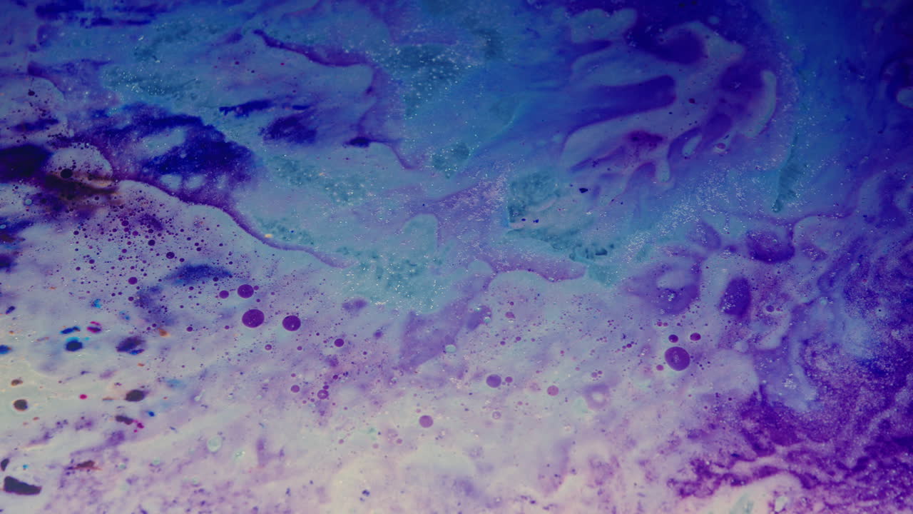 Colourful, organic, liquids macro shots buzzing and flowing