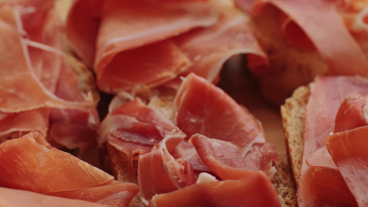Close-up of slices of Spanish ham on toasted bread
