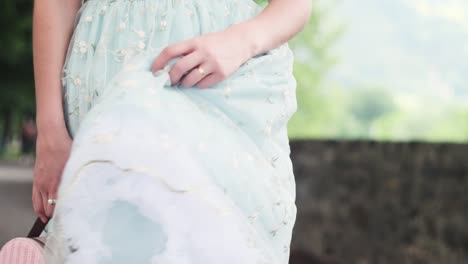 Girl-walking-through-park-with-vintage-Bag-and-Dress-after-shopping