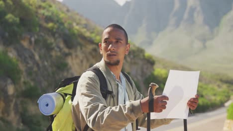 sporty mixed race man with prosthetic leg hiking