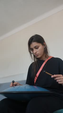 woman playing a pan flute