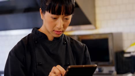 portrait of beautiful waitress using digital tablet 4k