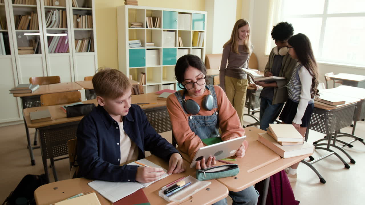 Diverse group of students working and collaborating in a classroom