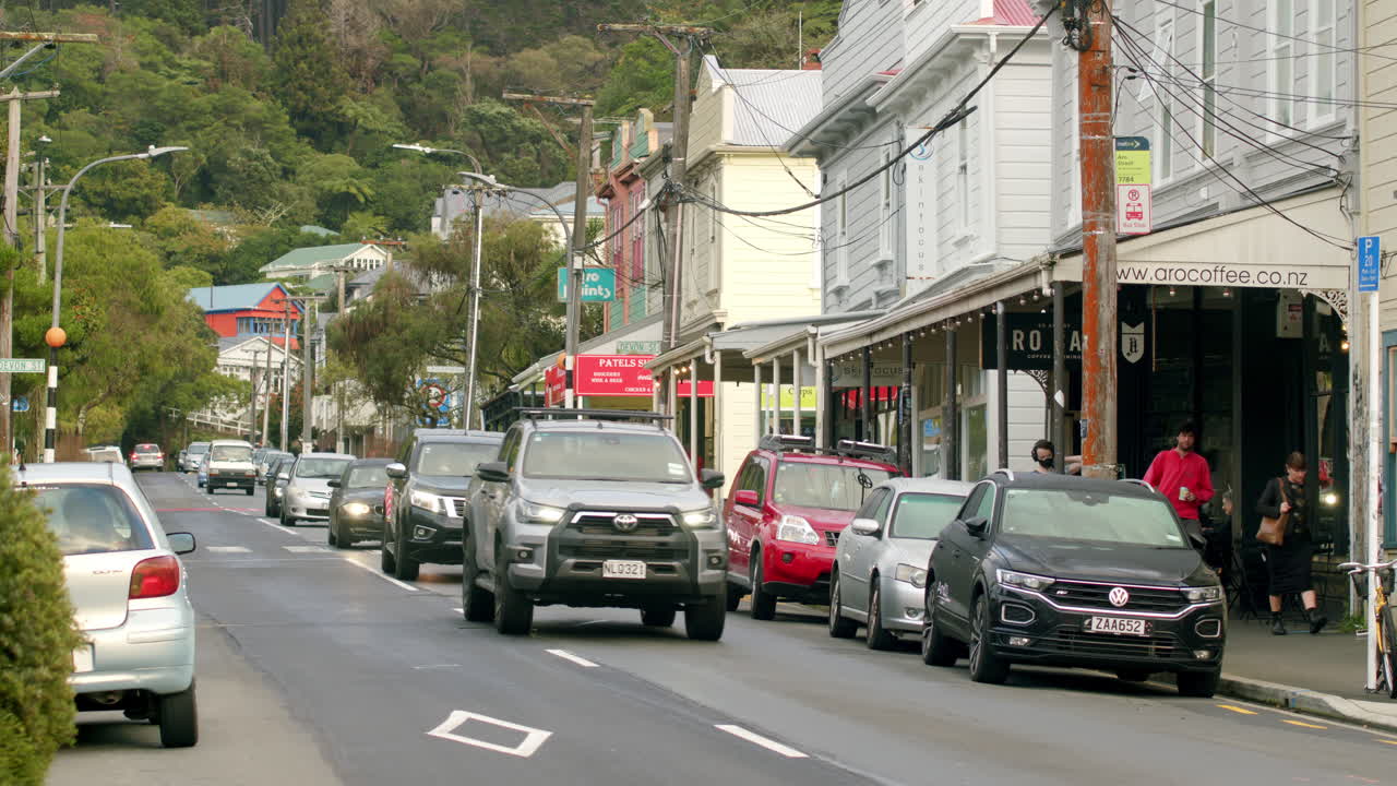 Looking up Aro Valley with a long line of cars, Wellington, New Zealand.