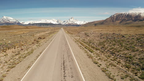 back view of girl waking toward the los glaciers national park at el chalten near santa cruz, patagonia, argentina.explorer enjoying the panorama in the wilderness of the steppe