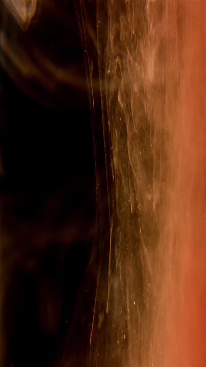 Inchiostro Etereo Marrone e Arancione che Turbina con Particelle Scintillanti