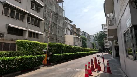 traffic barrier cone moves across urban street.