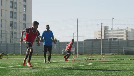 soccer kids exercising in a sunny day